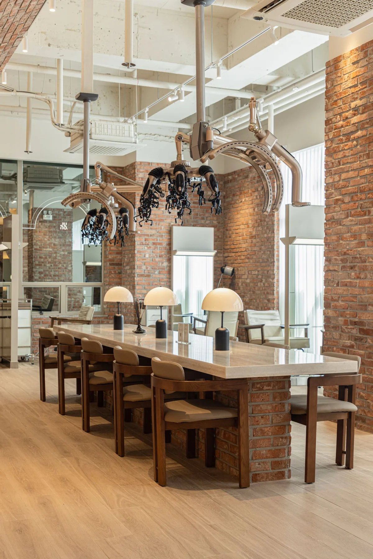 Long table with mushroom-shaped lamps